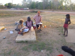 John Mawurndjul and Kay Linjiwanga look over some old photos with Jon Altman, side camp, Maningrida. (Source: Chris Gregory, 2014).